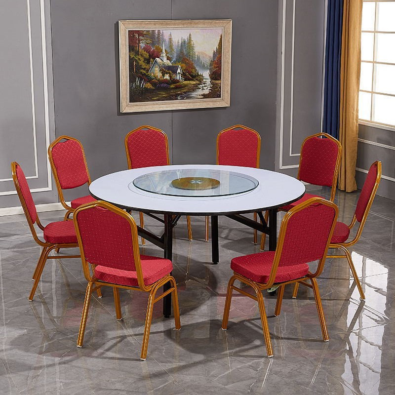 White round folding banqueting table arranged for venue dining